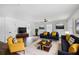 Bright living room featuring hardwood floors, neutral walls, stylish furniture, and natural lighting at 3280 Hazelwood Sw Dr, Atlanta, GA 30311