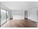Bright living room featuring hardwood floors, large sliding glass doors, and neutral walls at 3280 Hazelwood Sw Dr, Atlanta, GA 30311