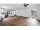 Spacious living room featuring hardwood floors with a view into the modern kitchen at 3280 Hazelwood Sw Dr, Atlanta, GA 30311