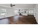 Open-concept living space with natural light, hardwood floors, and a stylish modern kitchen at 3280 Hazelwood Sw Dr, Atlanta, GA 30311