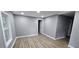 Bright room with natural light, gray walls, white trim, and modern flooring at 3814 Rex Rd, Rex, GA 30273