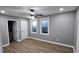 A spacious bedroom with modern ceiling fan and two windows, offering ample natural light at 3814 Rex Rd, Rex, GA 30273