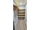 Walk-in closet featuring custom wood shelving and ample space for storage at 3814 Rex Rd, Rex, GA 30273