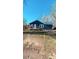 Charming home featuring navy blue siding, a wooden deck, and well-maintained landscaping at 3814 Rex Rd, Rex, GA 30273