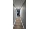 Hallway with modern flooring and freshly painted gray walls, leading to additional rooms at 3814 Rex Rd, Rex, GA 30273