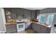 Well-lit kitchen showcasing new cabinets, countertops, and a modern design at 3814 Rex Rd, Rex, GA 30273