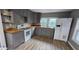Modern kitchen features gray cabinets, new appliances, and light wood countertops at 3814 Rex Rd, Rex, GA 30273
