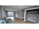Spacious living room with modern flooring, updated walls, and ample natural light at 3814 Rex Rd, Rex, GA 30273