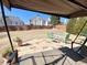 Patio with a swing, table, and chairs, offering a cozy outdoor space within a well-maintained backyard at 5066 Healey Dr, Smyrna, GA 30082