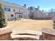 Expansive backyard with lush greenery, patio area, table, and chairs for relaxation and outdoor enjoyment at 5066 Healey Dr, Smyrna, GA 30082
