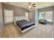 Comfortable bedroom with carpet flooring, ceiling fan and lots of windows at 5066 Healey Dr, Smyrna, GA 30082