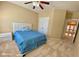 Comfortable bedroom with neutral walls, carpet, ceiling fan, and a well-lit open doorway at 5066 Healey Dr, Smyrna, GA 30082