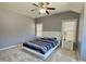 Bedroom featuring a ceiling fan and large windows at 5066 Healey Dr, Smyrna, GA 30082