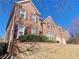 A beautiful two-story brick home with a three-car garage and lovely landscaping at 5066 Healey Dr, Smyrna, GA 30082