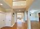 Grand foyer featuring high ceilings, hardwood floors, and an open staircase, creating a welcoming entrance to the home at 5066 Healey Dr, Smyrna, GA 30082