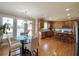 Sunlit eat-in kitchen boasting granite countertops, hardwood floors, and stainless appliances at 5066 Healey Dr, Smyrna, GA 30082