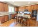 Spacious kitchen featuring stainless steel appliances, granite countertops and hardwood floors at 5066 Healey Dr, Smyrna, GA 30082