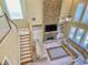 Top-down perspective of the living room showcasing a stone fireplace, abundant natural light, and comfortable seating at 5066 Healey Dr, Smyrna, GA 30082