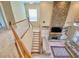 Spacious living room with a stone fireplace, plush sofa, and staircase leading upstairs at 5066 Healey Dr, Smyrna, GA 30082