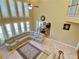 Aerial view of the living room with stone fireplace, large windows, staircase, and inviting furnishings at 5066 Healey Dr, Smyrna, GA 30082
