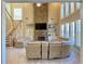 Open-concept living room featuring a stone fireplace, large windows, and staircase, creating a welcoming ambiance at 5066 Healey Dr, Smyrna, GA 30082