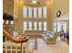 Bright living room with soaring ceilings, stone fireplace and an oversized sectional sofa at 5066 Healey Dr, Smyrna, GA 30082