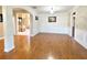 Spacious living room with hardwood floors, decorative molding, and an open layout, perfect for entertaining and relaxation at 5066 Healey Dr, Smyrna, GA 30082