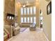 Spacious living room featuring a soaring stone fireplace, large windows, and comfortable seating arrangement at 5066 Healey Dr, Smyrna, GA 30082