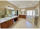 Main bathroom featuring double vanities, a jacuzzi tub, and a separate shower at 5066 Healey Dr, Smyrna, GA 30082