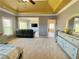 Large main bedroom featuring a seating area, dressing area, and tray ceiling at 5066 Healey Dr, Smyrna, GA 30082