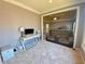 Sitting room near the main bedroom with a desk, television, and comfortable seating at 5066 Healey Dr, Smyrna, GA 30082