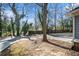 View of home's backyard, driveway, and fence, with partial view of the light blue siding on the house at 1032 Lena Nw St, Atlanta, GA 30314