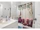 Bathroom with decorative shower curtain, mirror, and vanity at 1032 Lena Nw St, Atlanta, GA 30314