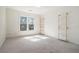 Inviting bedroom featuring a sunlit window and charming custom gold and white shelving at 1032 Lena Nw St, Atlanta, GA 30314