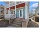 Close up view of the front porch entrance with brick steps on this two story home at 1032 Lena Nw St, Atlanta, GA 30314