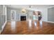 Open-concept living room featuring hardwood floors, fireplace, and view into the kitchen at 1032 Lena Nw St, Atlanta, GA 30314