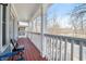 Upstairs porch with white railings, wood floors, and views of the neighborhood at 1032 Lena Nw St, Atlanta, GA 30314