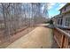 Grassy backyard with a privacy fence and mature trees, accessible from an elevated deck, ideal for outdoor entertaining at 2139 Golden Morning Ct, Kennesaw, GA 30152