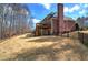 Beautiful backyard featuring a well-maintained lawn, a wooden deck, and perimeter fencing at 2139 Golden Morning Ct, Kennesaw, GA 30152