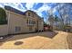 Wide angle of fenced backyard displaying a well-manicured lawn with trees and a tiered wooden deck at 2139 Golden Morning Ct, Kennesaw, GA 30152