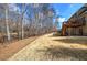 View of an expansive backyard with a well-kept lawn and a multi-level deck on the house at 2139 Golden Morning Ct, Kennesaw, GA 30152