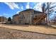 Large backyard view featuring a spacious lawn, and a wooden deck attached to the home at 2139 Golden Morning Ct, Kennesaw, GA 30152