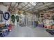 Spacious basement with exposed ceiling, metal dog kennel, and various organizational and work items at 2139 Golden Morning Ct, Kennesaw, GA 30152