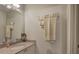 Neutral-toned bathroom features a granite countertop and towel rack with neatly folded towels at 2139 Golden Morning Ct, Kennesaw, GA 30152