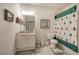 Cozy bathroom featuring a shower with festive tree-themed curtains and a granite countertop sink at 2139 Golden Morning Ct, Kennesaw, GA 30152