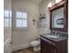 Elegant half bathroom with granite countertop and stylish mirror at 2139 Golden Morning Ct, Kennesaw, GA 30152