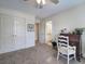 Bedroom with white doors, a view of the en suite bathroom, and a vintage secretary desk at 2139 Golden Morning Ct, Kennesaw, GA 30152