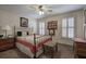 Charming bedroom with a patchwork quilt, two windows and decor at 2139 Golden Morning Ct, Kennesaw, GA 30152
