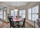 Cozy breakfast nook with a round table, chairs, and sunny windows with white shutters at 2139 Golden Morning Ct, Kennesaw, GA 30152