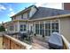 Spacious wooden deck featuring an outdoor dining set and grill, perfect for entertaining and enjoying outdoor meals at 2139 Golden Morning Ct, Kennesaw, GA 30152